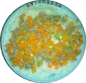 Noodles covered with carrot beef sauce