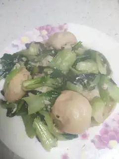The greens are fried with noodles