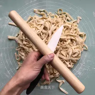 Hands on egg noodles