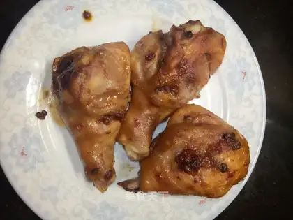 A chicken leg with peppers