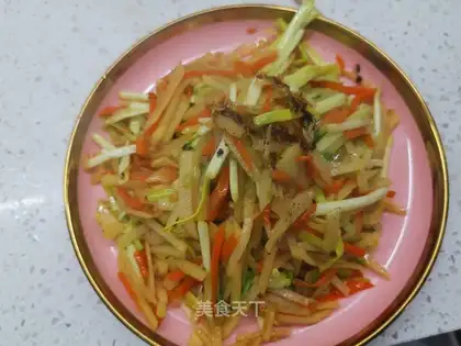 Garlic sprouts of potatoes and carrots