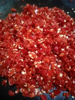 Farmer chopping peppers
