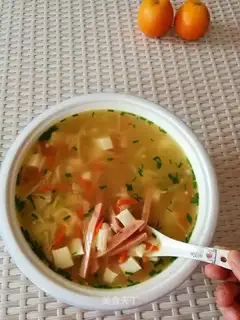 Gold pins, mushrooms, tofu soup