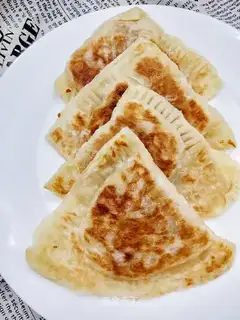A sour cake with a hand grab
