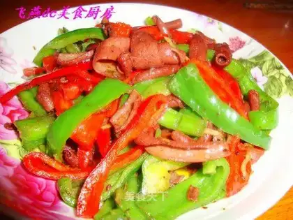 Fried duck sausage with green and red pepper
