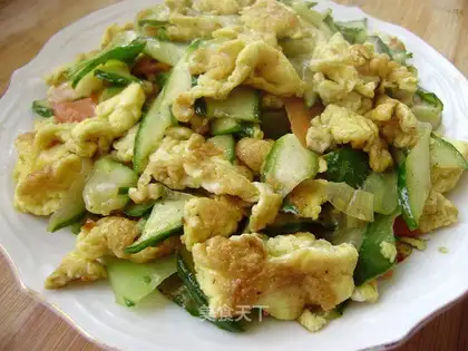 Scrambled eggs with cucumber slices