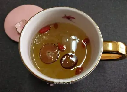 A silver spoon with red dates