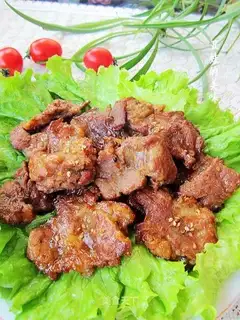 Roasted plum meat in barbecue sauce