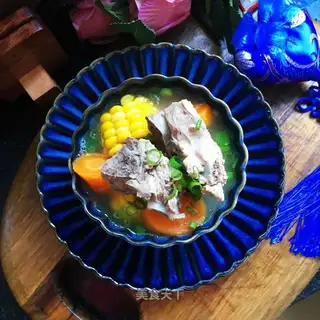 A pot of pottery steak corn soup