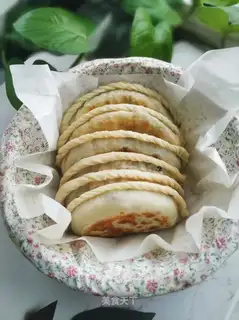 An egg box with a pickle