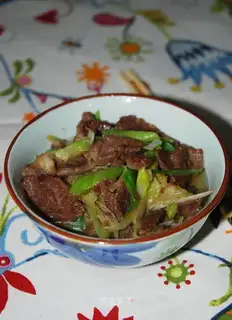 lamb with fried green onions