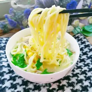 Hands on egg noodles
