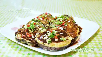 Red sauce pours a big eggplant