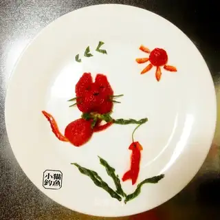 Puss fishing for strawberries