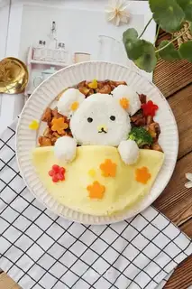 Children's little bear is spoiling chicken and rice