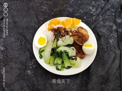 The duck's leg is covered in rice
