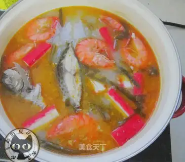A greasy seafood soup
