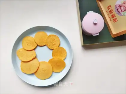 Baby eats potato carrots and eggs