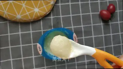 The baby eats yogurt