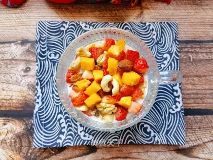 Mango strawberry nuts and yogurt