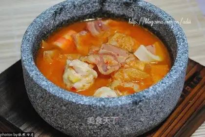 Stone pot fish balls and pickled vegetables soup