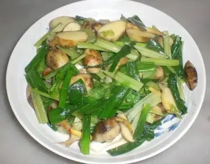 stir-fried arrowhead mushrooms with garlic sprouts and celery