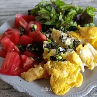 Eggs and tomatoes with green leaves