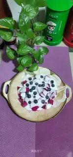 Sour yogurt with dragon nuts and blueberries