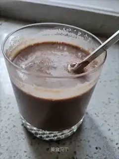 Hand on cocoa milk