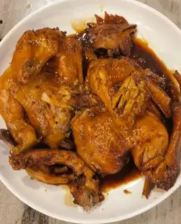 A chicken with a pan