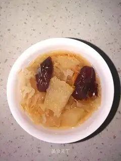 A silver spoon with dates