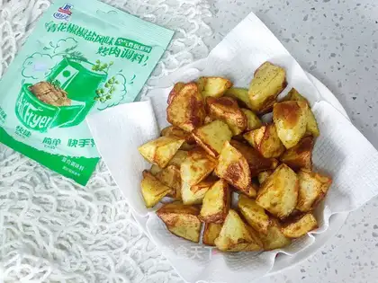 Air frying pots of peppers and potatoes