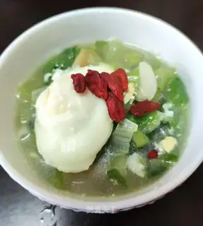 Yellow rice cake and egg soup