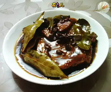A pork chop with sauce