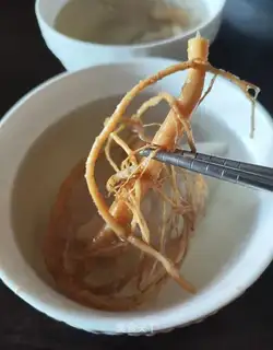 The young man's cooking chicken chest