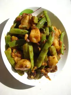Baked potatoes and beans in sauce
