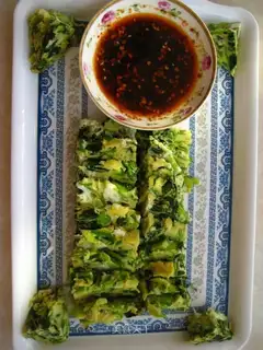Spinach cake dipped in water