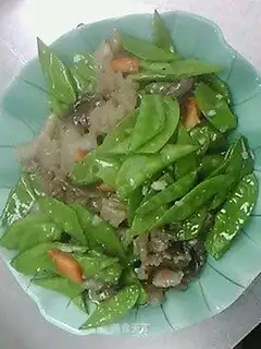 Fried beef penis with peas