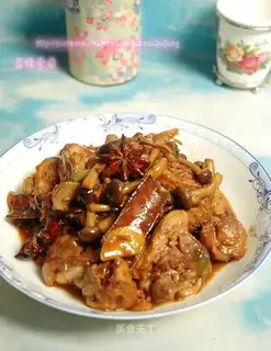 Roasted chicken legs with small mushrooms