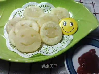 Smiley face potato cake