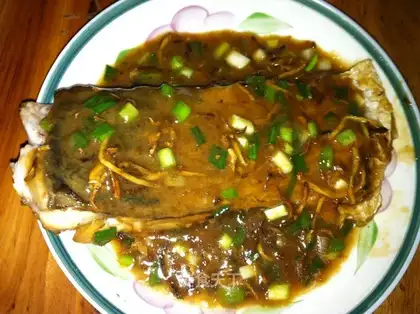 Pan-fried fish steak in soy sauce