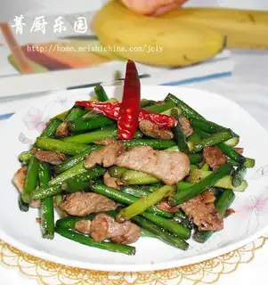 Stir fried pork slices with garlic sprouts