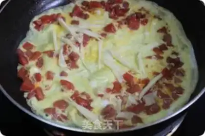 Make Egg wrapped with tomato cheese and ham step 4
