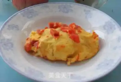 Make Egg wrapped with tomato cheese and ham step 5