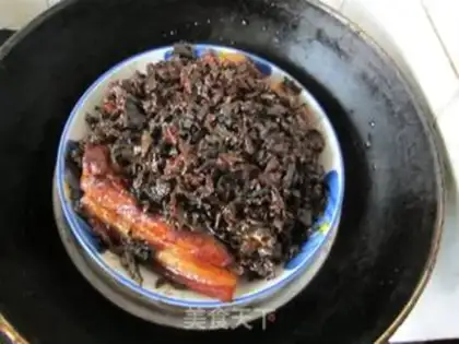 Make braised pork with dried plum vegetables step 11
