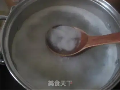 Make congee with pork and century step 9
