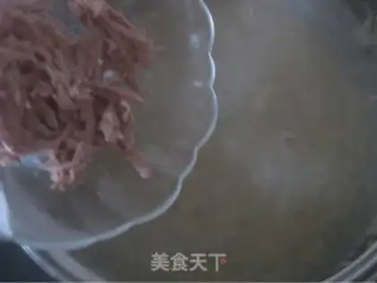 Make congee with pork and century step 14