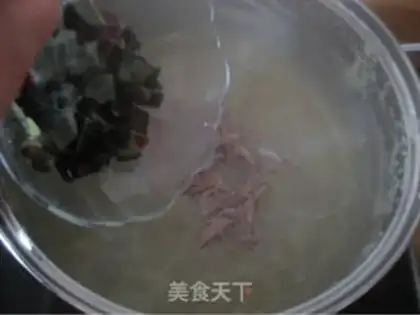 Make congee with pork and century step 15
