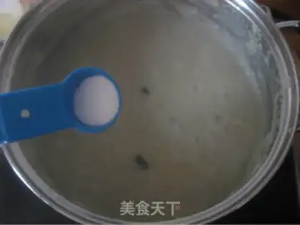 Make congee with pork and century step 16