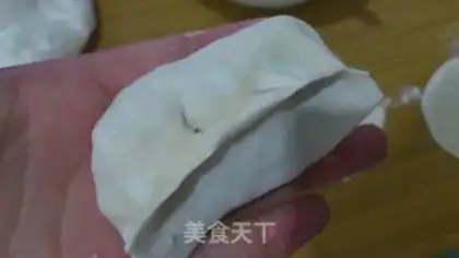 Make Steamed dumplings with pickled cabbage and pork step 11